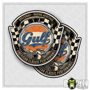 May include: A circular sticker featuring a vintage Gulf logo in orange and blue, surrounded by a black and white checkered border. The design includes a classic hot rod engine, a racing helmet, and the text Speedway Racing Heritage and American Classic Performance.