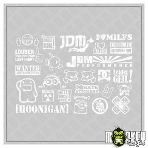 May include: A collection of white vinyl decals featuring various graphic designs, including text such as JDM, HOONIGAN, LOUDER than your Mum, WANTED, and various cartoon characters, skulls, and symbols arranged on a light grey background.