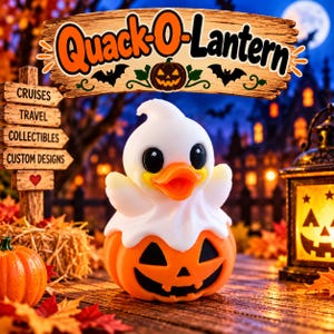 May include: A white ghost-shaped rubber duck sitting inside an orange jack-o'-lantern base. Above, a wooden sign displays the text Quack-O-Lantern with a pumpkin icon and bats. The scene includes autumn leaves and a glowing lantern.