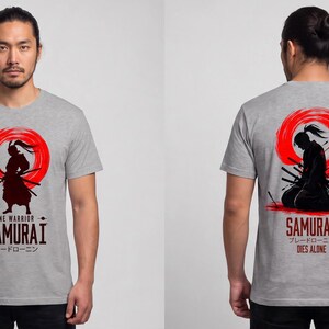 May include: A heather gray short-sleeve t-shirt featuring a graphic of a samurai silhouette against a red circle. The front displays the text LONE WARRIOR SAMURAI. The back shows a kneeling samurai with the text SAMURAI DIES ALONE.
