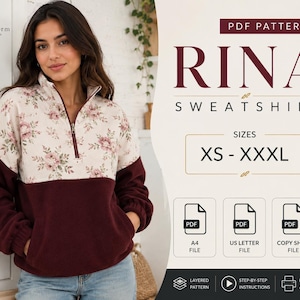Puede incluir: Un patrón de costura en PDF para la sudadera Rina, con un diseño de cremallera de un cuarto, sección superior con estampado floral y sección inferior en color granate oscuro. El patrón incluye tallas de XS a XXXL, con archivos A4, US Letter y copy shop.