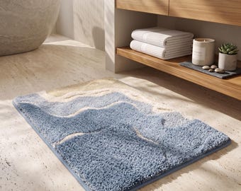 Blaue Badematte mit abstraktem Wellenmuster, weicher Badteppich, modernes Küsten-Dekor
