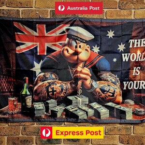 May include: A rectangular wall flag featuring a graphic of Popeye wearing a sailor hat with the word AUSTRALIA, surrounded by stacks of cash, a bottle, and a glass. The background displays the Australian flag and the text THE WORLD IS YOURS.