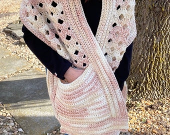 Cascade Pocket Shawl in shades of ivory, and shades of pale pink and peach.