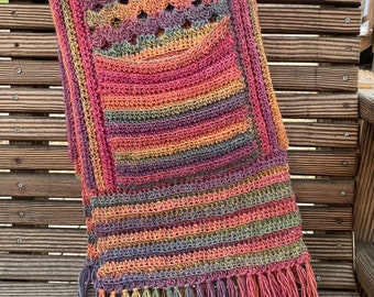 Cascade Pocket Shawl in shades of pink, orange, blue, purple and green ombré