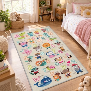 May include: A rectangular area rug featuring a colorful alphabet design with illustrations of animals corresponding to each letter from A to Z, including a green alligator, blue bear, orange cat, and a large blue whale at the bottom.