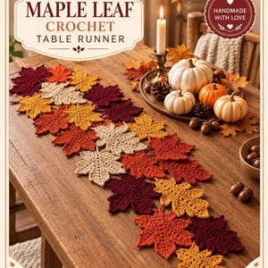 Puede incluir: Un camino de mesa de ganchillo compuesto por formas de hojas de arce entrelazadas en tonos burdeos, naranja, amarillo y crema. El texto "MAPLE LEAF CROCHET TABLE RUNNER" y "HANDMADE WITH LOVE" es visible en la parte superior.