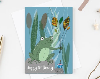 Frog Hoppy birthday card. Featuring a frog holding leaf balloons with a cupcake. Nature lovers card. Kids birthday card. Cute frog card.