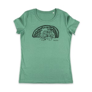 May include: A green t-shirt with a black and white illustration of a bear and cubs in a forest. The text "doodle" is printed below the illustration.