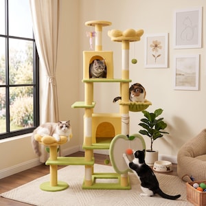 May include: A multi-level cat tree featuring yellow and green platforms, a central cubby, a flower-shaped perch, and an apple-shaped scratching board. The structure includes sisal-wrapped posts, hanging toy attachments, and soft fabric surfaces.