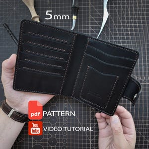 May include: A black leather bifold wallet featuring multiple card slots and a central pocket with the embossed text BARCA. The wallet includes a side strap with a metal snap closure. The image displays the text 5mm, pdf PATTERN, and YouTube VIDEO TUTORIAL.