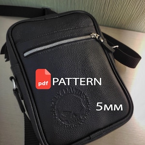May include: A black textured crossbody bag with a front zippered pocket and an adjustable strap. The bag features a circular embossed logo and the text "pdf PATTERN" and "5mm" overlaid on the front surface of the bag.