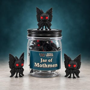 May include: A clear plastic jar with a black lid, filled with small black moth-like figurines with bright red eyes. A label on the jar reads Moth & Squatch Trading Co. Jar of Mothmen. Two additional moth figurines stand on either side of the jar.