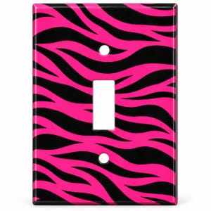 May include: A rectangular light switch wall plate featuring a vibrant hot pink and black zebra stripe pattern. The cover includes a central rectangular cutout for a toggle switch and two circular holes for mounting screws at the top and bottom.