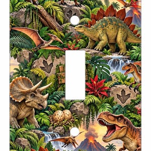 May include: A rectangular light switch cover plate featuring a vibrant prehistoric jungle scene with various dinosaurs including a Stegosaurus, Triceratops, and T-Rex, lush green foliage, rocky terrain, waterfalls, and a volcanic eruption.