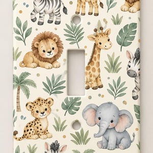 May include: A rectangular light switch plate featuring a repeating pattern of watercolor-style baby jungle animals including a zebra, giraffe, lion, leopard, and elephant, interspersed with green palm leaves and small gold dots on a cream background.