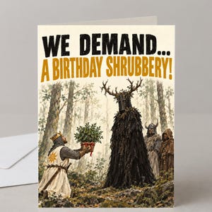 May include: A greeting card featuring a knight in a white tunic with a sun emblem offering a potted plant to a tall, dark, antlered figure in a forest. The text at the top reads, WE DEMAND... A BIRTHDAY SHRUBBERY! in bold black and yellow letters.