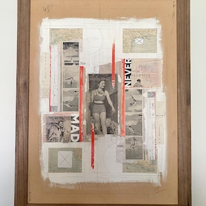 May include: A framed mixed-media collage on a tan background featuring black-and-white vintage photographs of people, including a person in a swimsuit, map fragments, and red vertical strips. The text includes the words NEVER, MAD, and reste.
