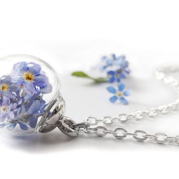 real forget-me-not flowers by hand and fashioned into a long-lasting jewel