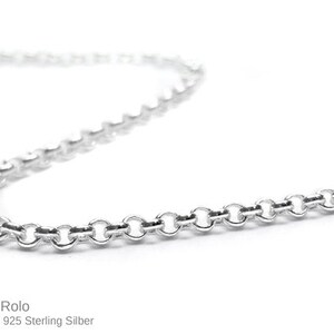 May include: A silver rolo chain necklace. The chain is made of small, round links.  The chain is a popular choice for both men and women.