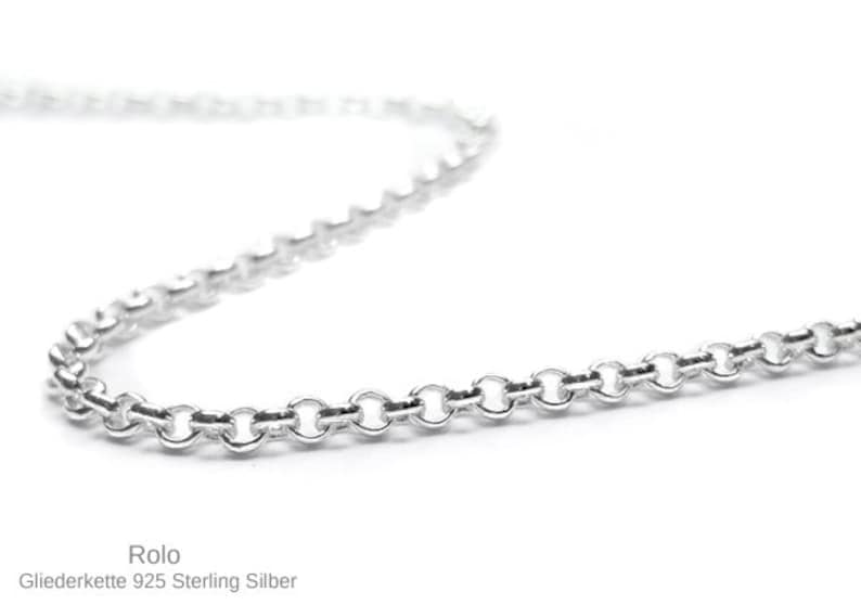 May include: A silver rolo chain necklace. The chain is made of small, round links.  The chain is a popular choice for both men and women.