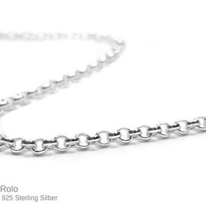 May include: A silver rolo chain necklace. The chain is made of small, round links. The chain is a popular choice for both men and women.