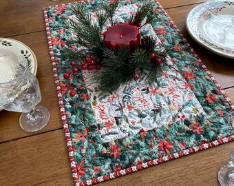 Quilted Christmas table topper of red green,& white, Designer Christmas text print with greenery, Christmas topper, Christmas centerpiece