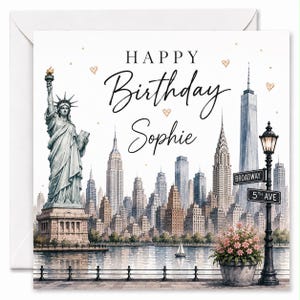 May include: A square greeting card featuring a watercolour illustration of the New York City skyline, the Statue of Liberty, and a street lamp with Broadway and 5th Ave signs. The text reads HAPPY Birthday Sophie with small hearts.