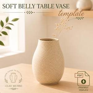 May include: A beige speckled vase with a rounded belly and narrow neck, containing a sprig of dried flowers. Text reads: SOFT BELLY TABLE VASE template, FROM PAPER TO POTTERY CLAY METRIC, and PDF PRINTABLE TEMPLATE with a download icon.