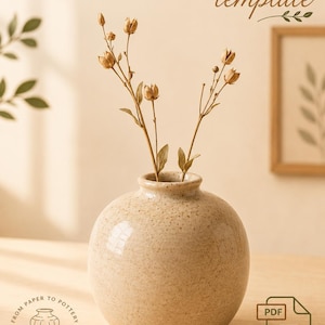 May include: A round, speckled beige ceramic bud vase with a narrow neck, containing three dried stems with small seed pods. The text reads ROUND BUD TABLE VASE template, FROM PAPER TO POTTERY, CLAY METRIC, and PDF PRINTABLE TEMPLATE.