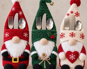 May include: Three crochet gnome silverware holders featuring red, green, and cream colors. Each gnome has a white faux fur beard, a tall pointed hat with a pom-pom or bell, and a pocket containing a silver fork, knife, and spoon set.