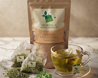 May include: A brown paper pouch labeled Moringa 100% Pure Moringa Tea and Moringa Leaf Tea Bag Premium Blend, accompanied by two pyramid tea bags, loose dried leaves, and a glass cup filled with steeped tea and a tea bag.