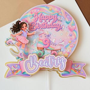 May include: A circular cake topper featuring a pastel rainbow background with the text Happy Birthday and the number 9 on a roller skate. A cartoon character on roller skates is on the left, and a banner at the bottom displays the name Beatriz.