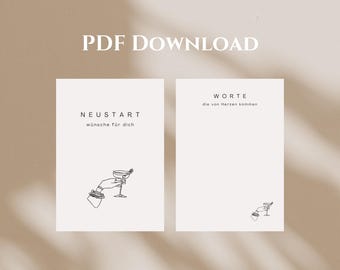 May include: Two white rectangular cards with black line art illustrations of a hand holding a cocktail glass. The left card features the text NEUSTART wünsche für dich, and the right card features the text WORTE die von Herzen kommen.