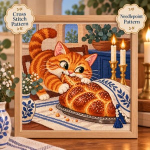 May include: A framed cross stitch and needlepoint pattern featuring an orange tabby cat reaching for a braided loaf of bread on a table. The scene includes two lit candles in gold holders, a blue and white patterned cloth, and a blue vase.