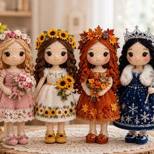 May include: Four handmade crochet dolls standing in a row. The first has blonde hair with a pink flower crown and bouquet. The second has brown hair with sunflowers. The third has red hair with autumn leaves. The fourth has black hair with a crown.