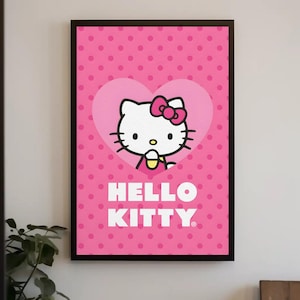 Puede incluir: Una lámina decorativa enmarcada con fondo rosa y un patrón de lunares de color rosa oscuro. En el centro, un gran corazón rosa claro contiene un gráfico de Hello Kitty con un lazo rosa. El texto HELLO KITTY aparece impreso en blanco debajo.