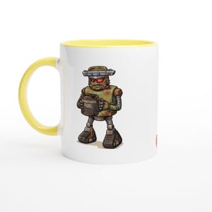 May include: A white ceramic mug with a bright yellow handle and interior rim. The front features a graphic of a rusty, weathered robot with red eyes holding a dark mug labelled "ADMINISTRATIVE FUEL" in white text, standing on tank treads.