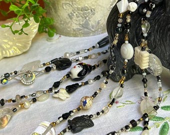 RARE* Vintage one of a kind 58 1/2” long varied glass beaded necklace.