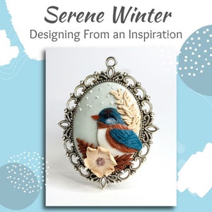 May include: A silver oval pendant with a bluebird perched on a branch with a white flower. The bird is brown, white, and blue. The background is a light blue with white snowflakes.
