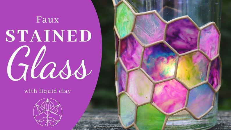 May include: Faux stained glass votive holder made with liquid clay. The holder is decorated with a honeycomb pattern and features a variety of colors, including pink, purple, green, and blue. The holder is lit from within, creating a warm glow.