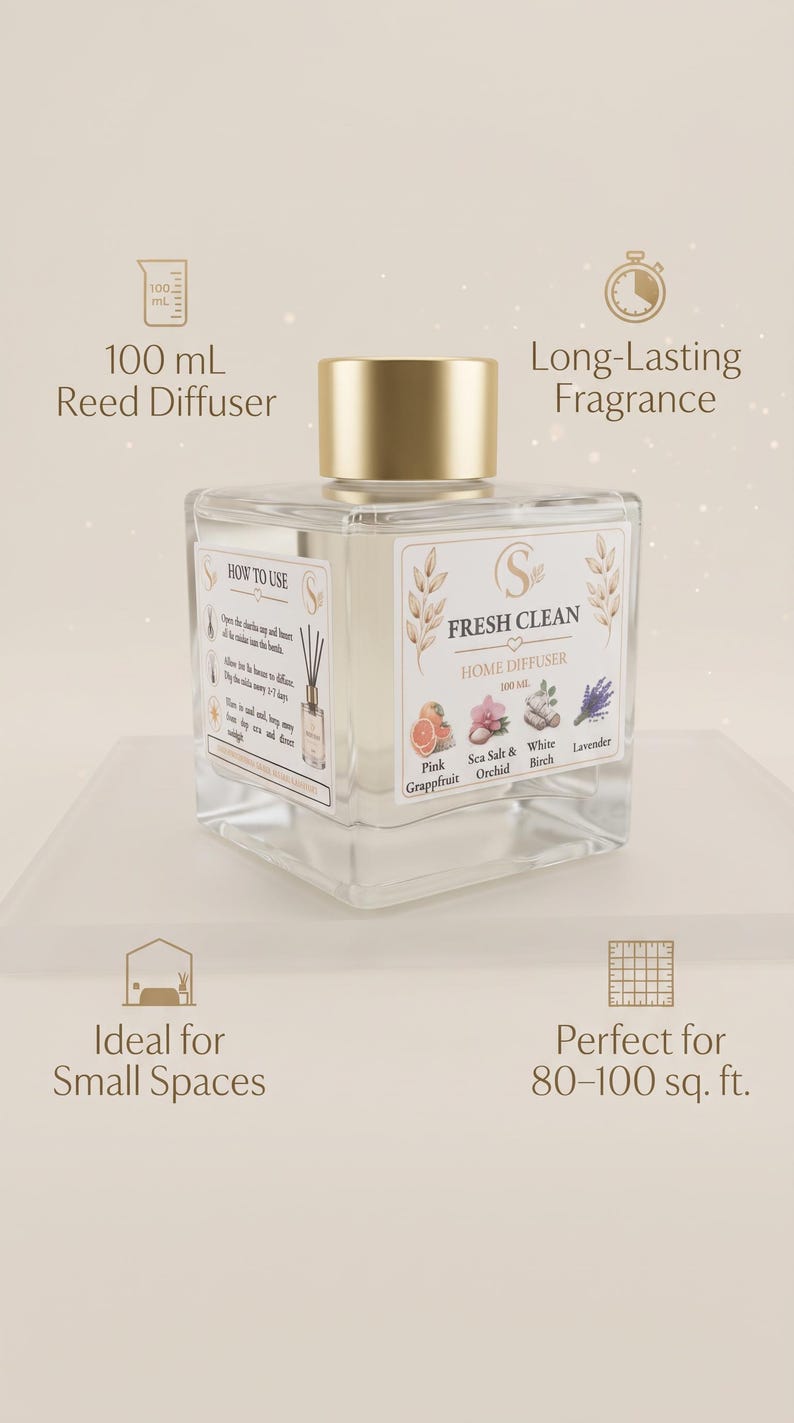 May include: A square glass reed diffuser bottle with a gold cap and a white label reading Fresh Clean Home Diffuser 100 mL. The label features illustrations of pink grapefruit, sea salt, orchid, white birch, and lavender. Text includes 100 mL Reed Diffuser, Long-Lasting Fragrance, Ideal for Small Spaces, and Perfect for 80-100 sq. ft.