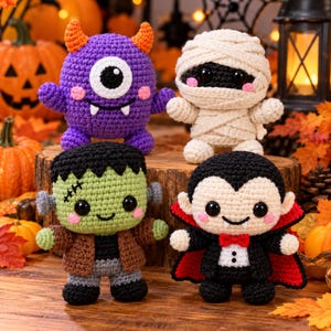 May include: Four crocheted Halloween figures including a purple one-eyed monster with orange horns, a cream-colored mummy wrapped in yarn, a green Frankenstein-style creature with black hair, and a vampire wearing a black cape with a red lining.