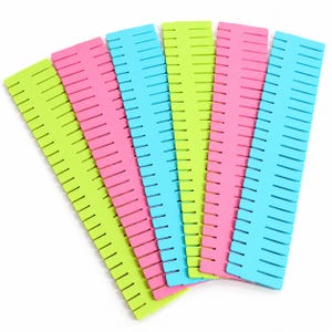 May include: A set of five rectangular drawer dividers arranged in a fan shape. The dividers are made of plastic in bright neon colors including lime green, hot pink, and cyan blue. Each divider features a series of evenly spaced vertical slots.