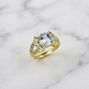 Bague ovale en aigue-marine, anneau fendu, sertie de pierres, or jaune, joaillerie fine