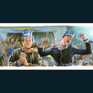May include: Two men wearing blue and white paper crowns with the words "National Treasure" on them. One man is clapping his hands and the other is raising his arms in the air. The men are in a crowd of people.