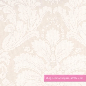 May include: A light beige fabric featuring a repeating white damask pattern of large, ornate acanthus leaves and small floral motifs. A pink rectangular banner at the bottom right contains the white text shop.seemannsgarn-stoffe.com.