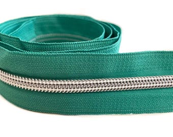 Turquoise/zilveren rits met 3 ritstrekkers, 100 cm.