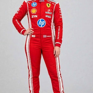 May include: A red racing suit featuring white side stripes and various sponsor logos including HP, Shell, IBM, and Richard Mille. The suit displays the number 16 and the name Charles with a small flag emblem on the chest area.