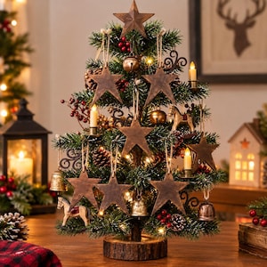 May include: A tabletop artificial Christmas tree on a round wooden base, decorated with brown metal star ornaments, small bells, miniature rocking horses, red berries, pinecones, and small electric candles with warm white lights.